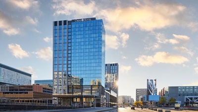 bossea-omni-boston-seaport-exterior-sunset